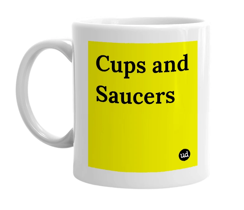 White mug with 'Cups and Saucers' in bold black letters