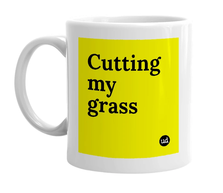 White mug with 'Cutting my grass' in bold black letters