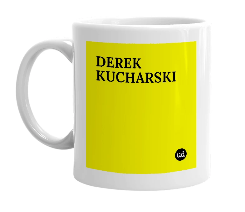 White mug with 'DEREK KUCHARSKI' in bold black letters