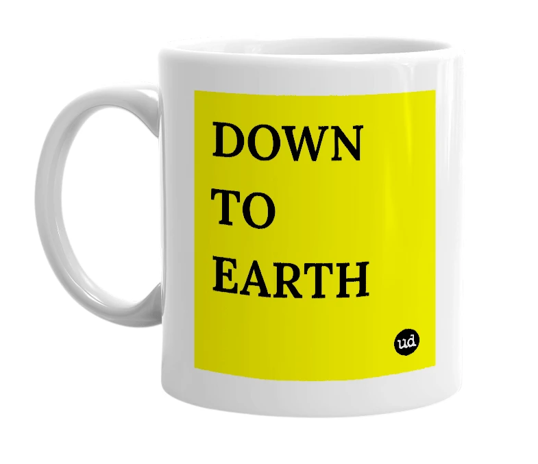 White mug with 'DOWN TO EARTH' in bold black letters