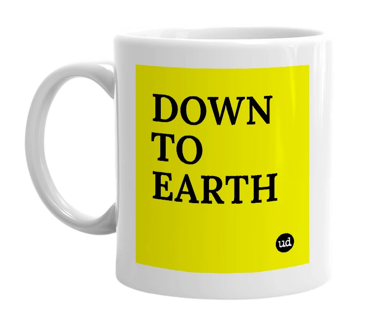 White mug with 'DOWN TO EARTH' in bold black letters