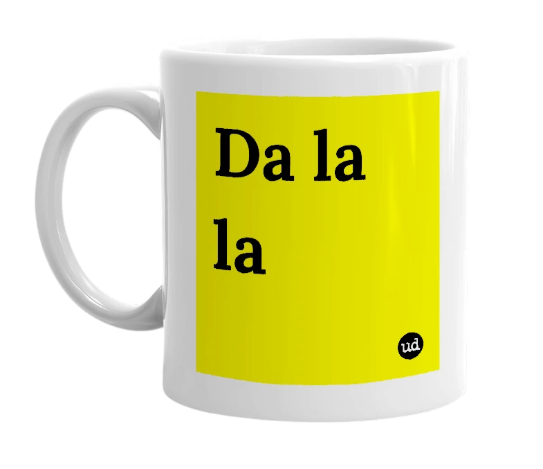 White mug with 'Da la la' in bold black letters