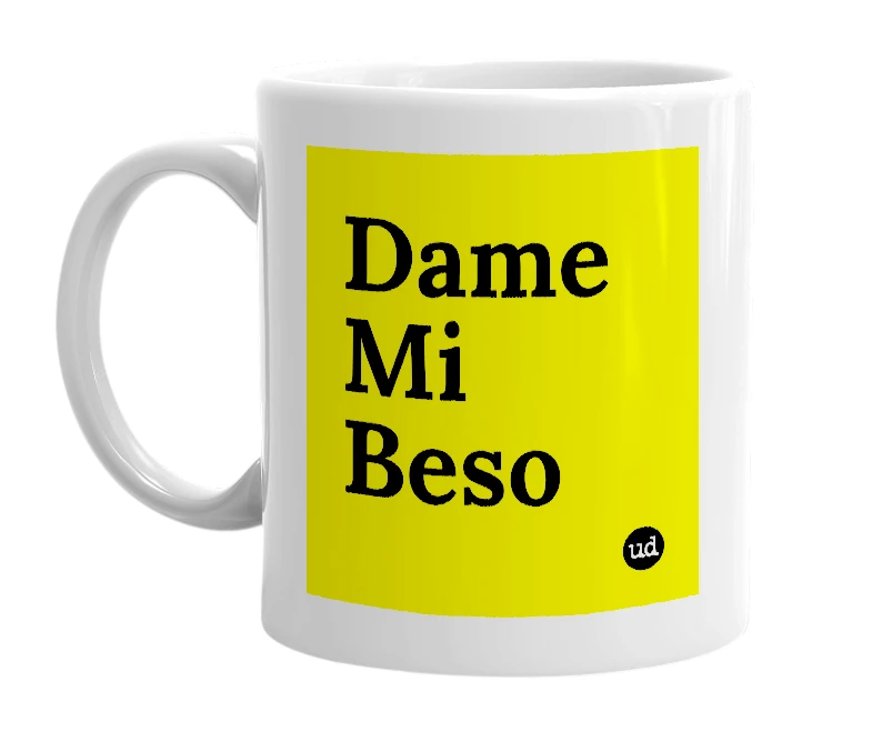 White mug with 'Dame Mi Beso' in bold black letters