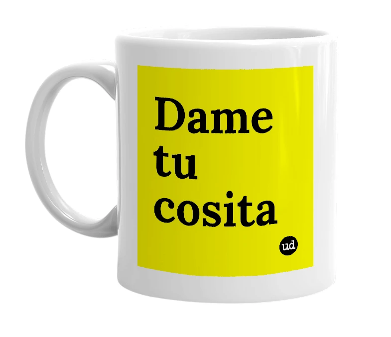 White mug with 'Dame tu cosita' in bold black letters
