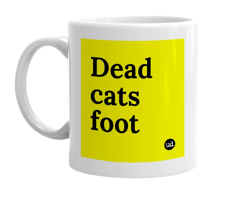 White mug with 'Dead cats foot' in bold black letters