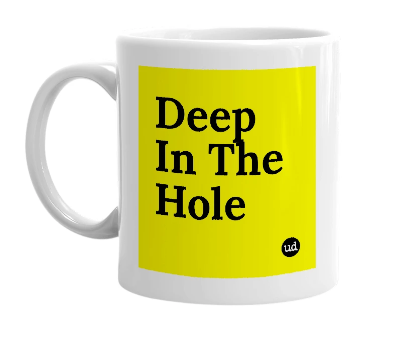 White mug with 'Deep In The Hole' in bold black letters
