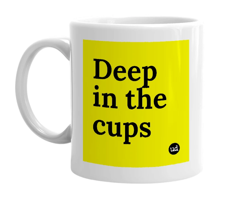 White mug with 'Deep in the cups' in bold black letters