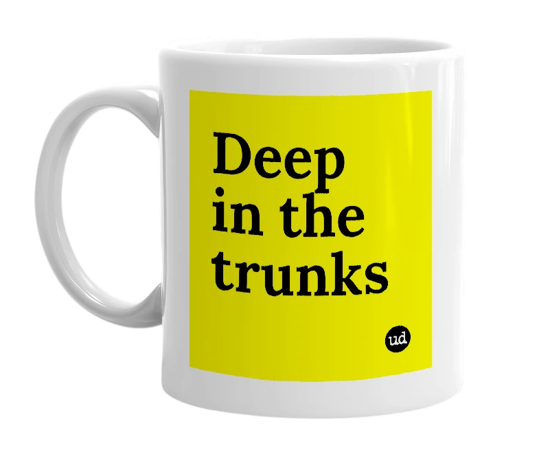 White mug with 'Deep in the trunks' in bold black letters