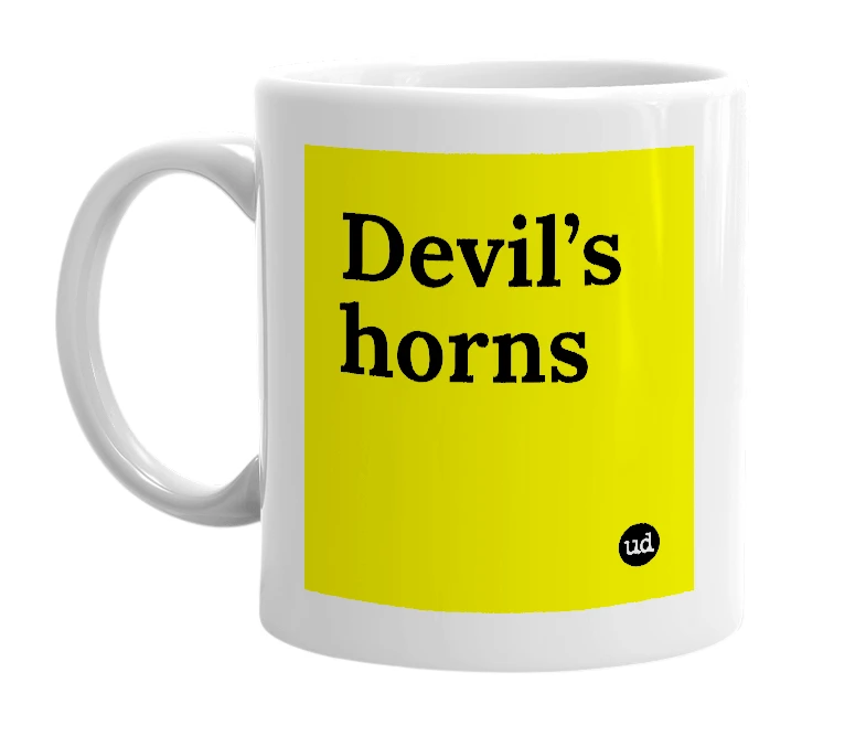 White mug with 'Devil’s horns' in bold black letters