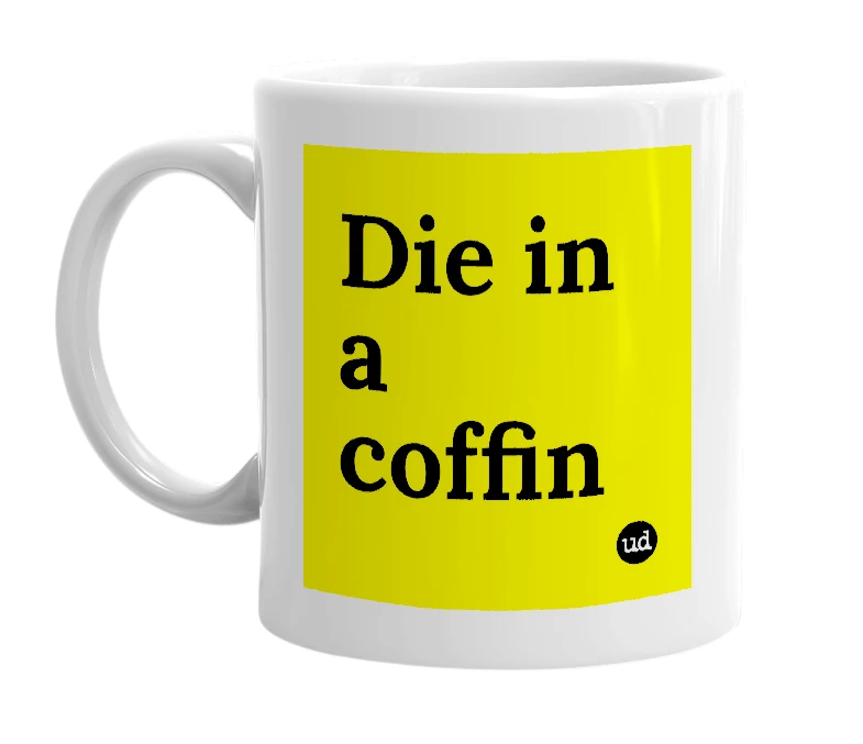 White mug with 'Die in a coffin' in bold black letters