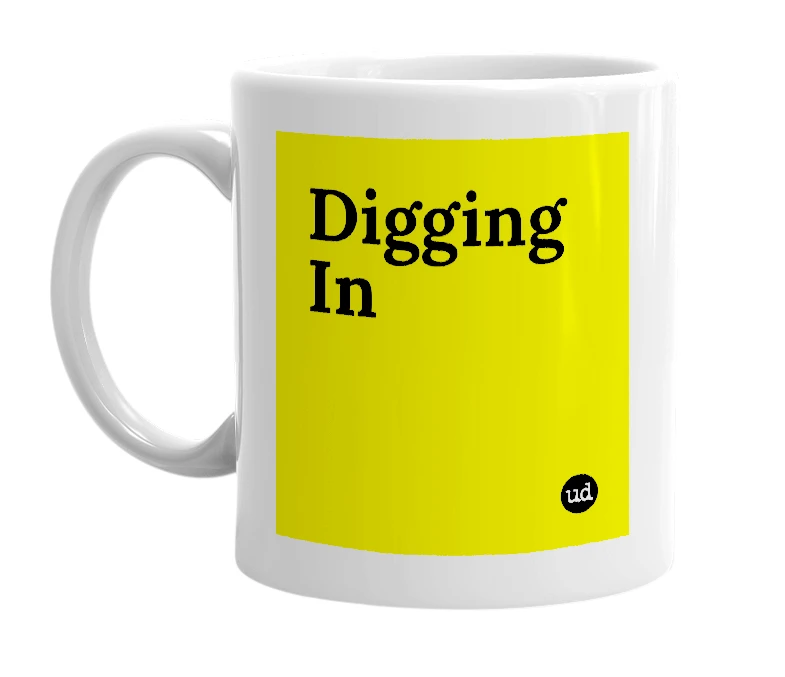 White mug with 'Digging In' in bold black letters