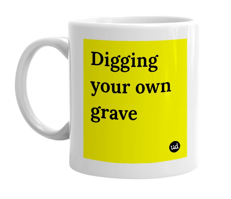 White mug with 'Digging your own grave' in bold black letters