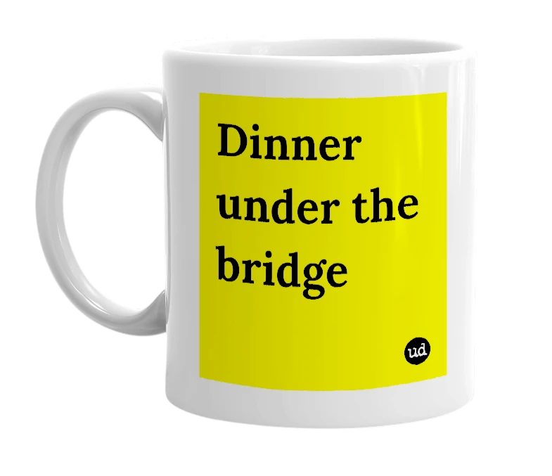 White mug with 'Dinner under the bridge' in bold black letters