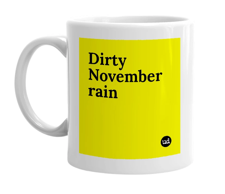 White mug with 'Dirty November rain' in bold black letters