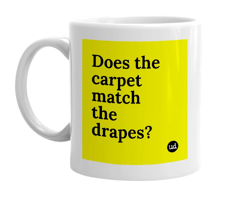 White mug with 'Does the carpet match the drapes?' in bold black letters