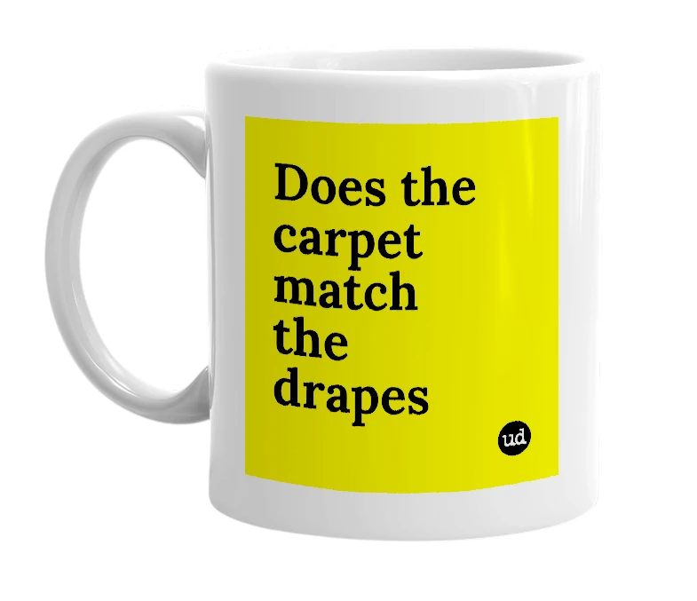 White mug with 'Does the carpet match the drapes' in bold black letters