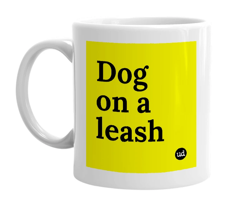 White mug with 'Dog on a leash' in bold black letters