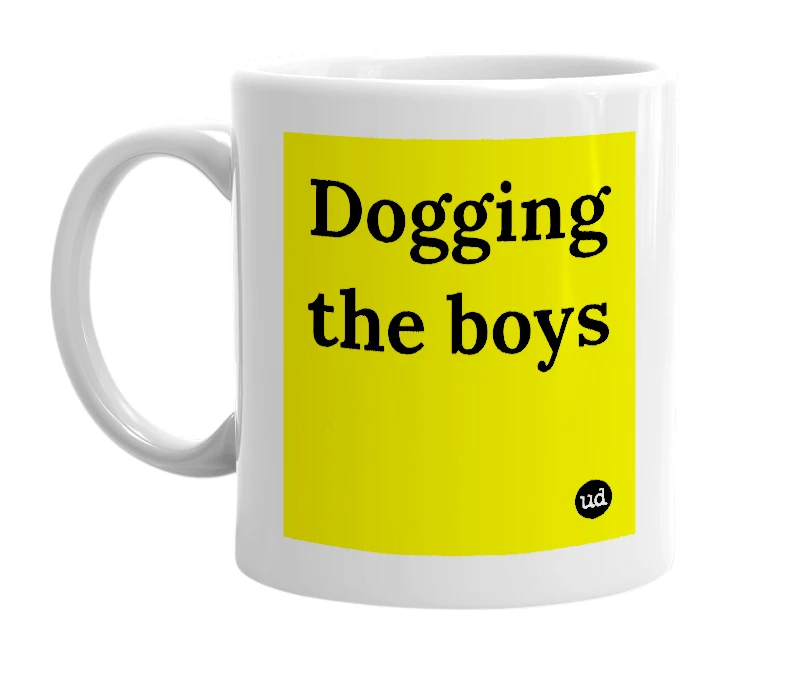 White mug with 'Dogging the boys' in bold black letters