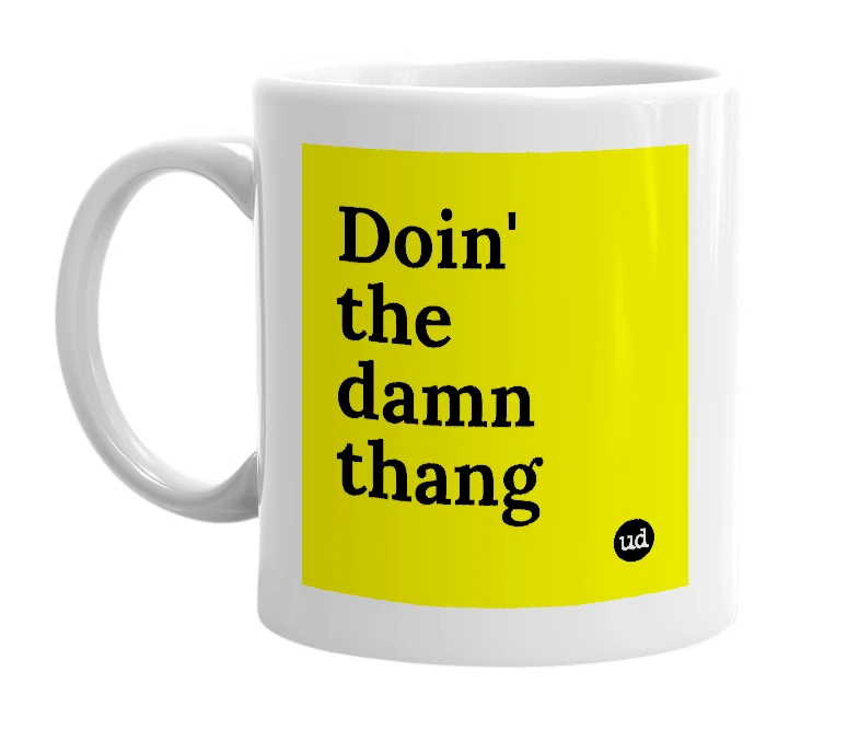 White mug with 'Doin' the damn thang' in bold black letters