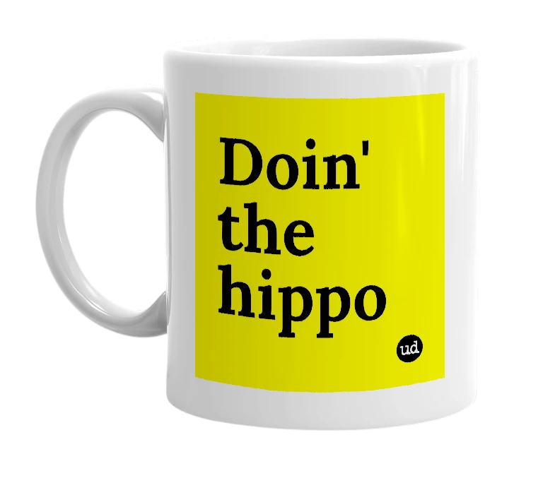 White mug with 'Doin' the hippo' in bold black letters