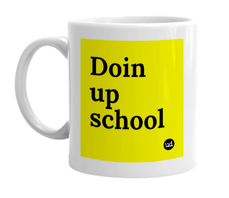 White mug with 'Doin up school' in bold black letters