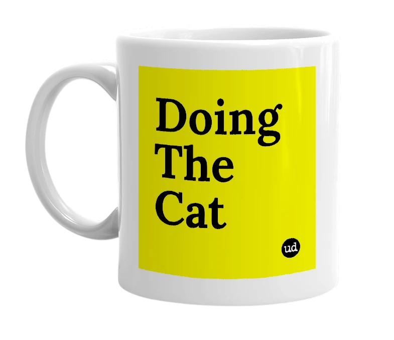 White mug with 'Doing The Cat' in bold black letters