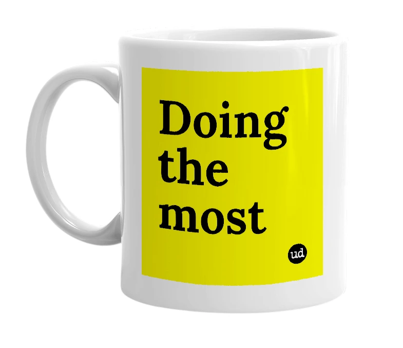 White mug with 'Doing the most' in bold black letters