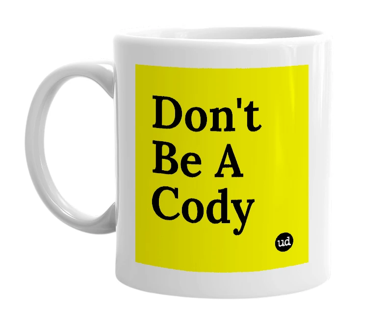 White mug with 'Don't Be A Cody' in bold black letters