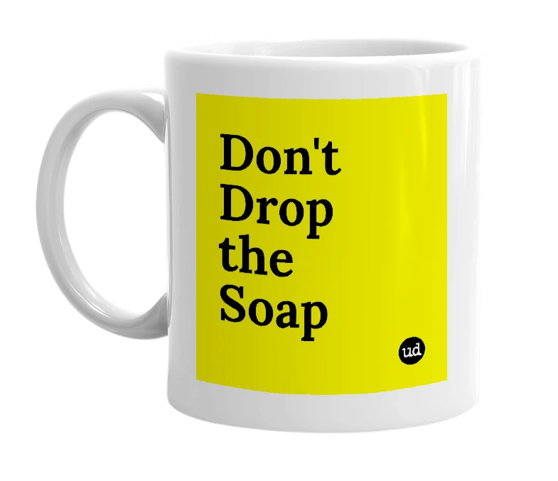 White mug with 'Don't Drop the Soap' in bold black letters