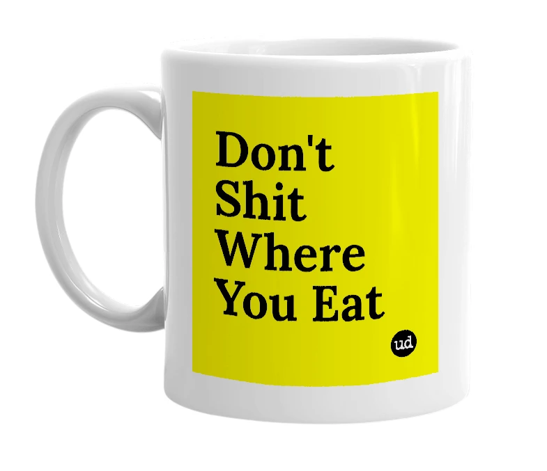 White mug with 'Don't Shit Where You Eat' in bold black letters