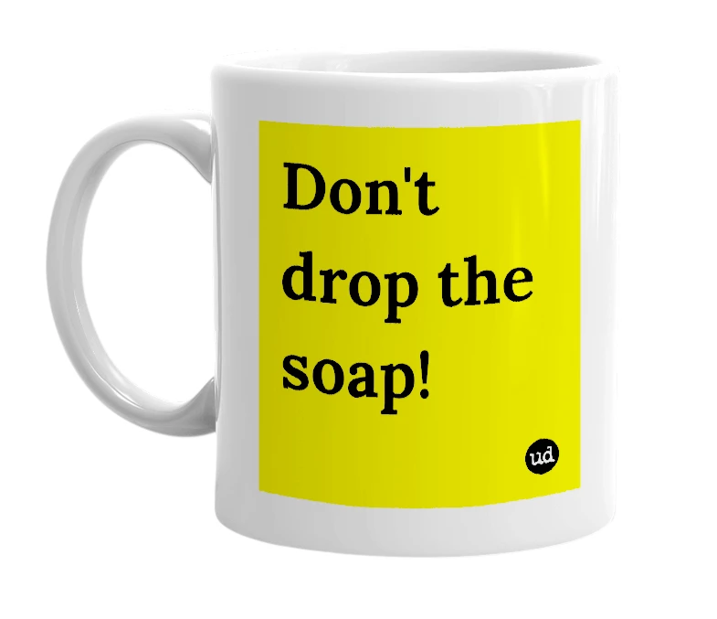 White mug with 'Don't drop the soap!' in bold black letters