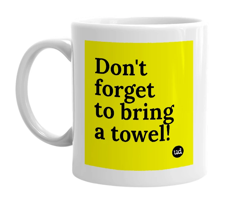 White mug with 'Don't forget to bring a towel!' in bold black letters