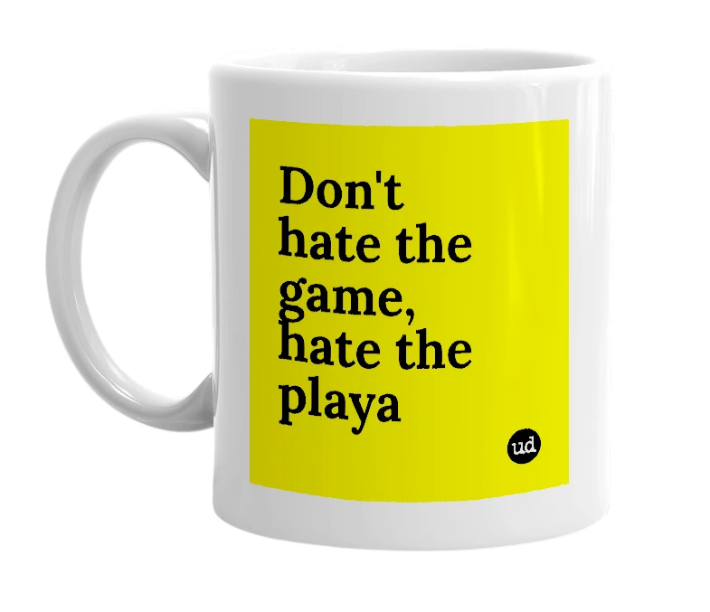 White mug with 'Don't hate the game, hate the playa' in bold black letters