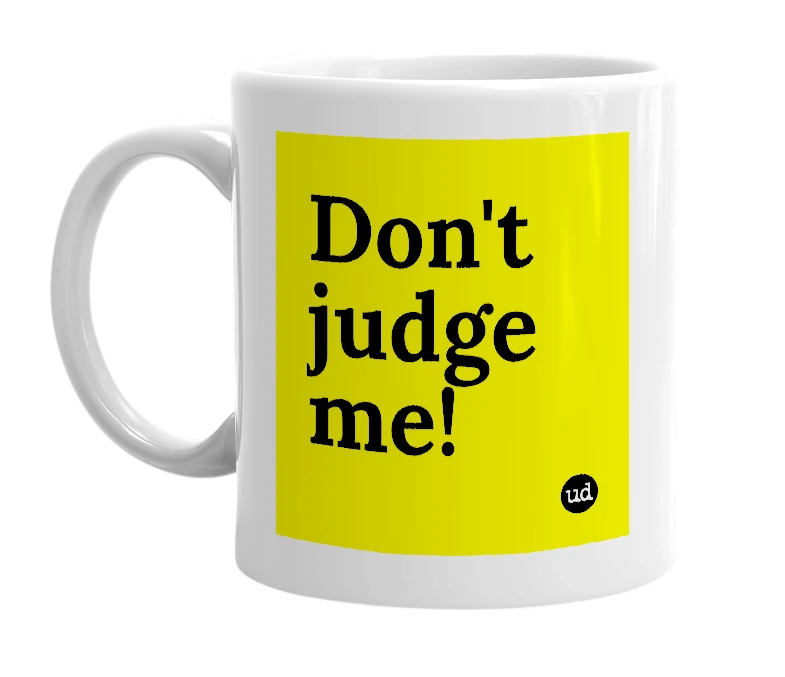 White mug with 'Don't judge me!' in bold black letters