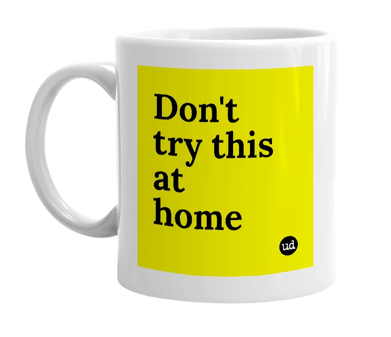 White mug with 'Don't try this at home' in bold black letters