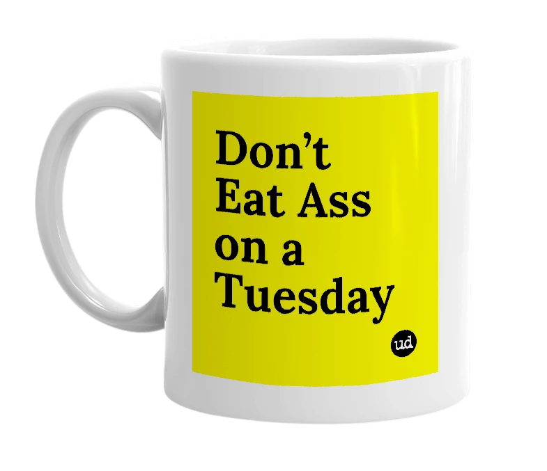 White mug with 'Don’t Eat Ass on a Tuesday' in bold black letters