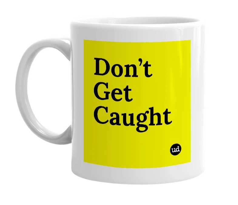 White mug with 'Don’t Get Caught' in bold black letters