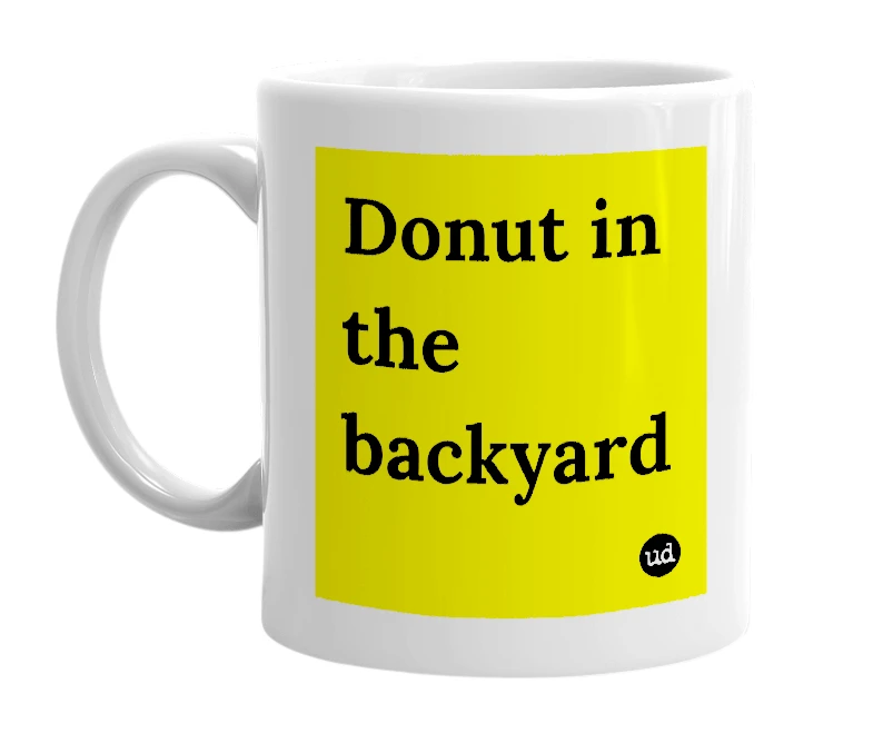 White mug with 'Donut in the backyard' in bold black letters