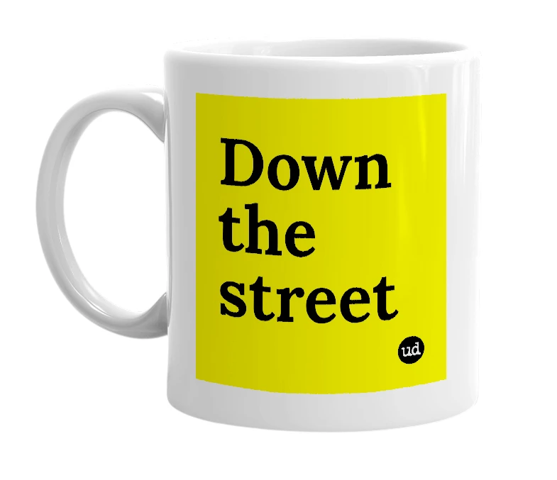 White mug with 'Down the street' in bold black letters