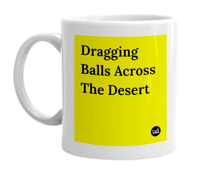 White mug with 'Dragging Balls Across The Desert' in bold black letters