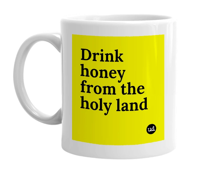 White mug with 'Drink honey from the holy land' in bold black letters