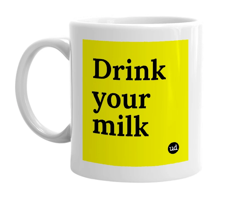 White mug with 'Drink your milk' in bold black letters