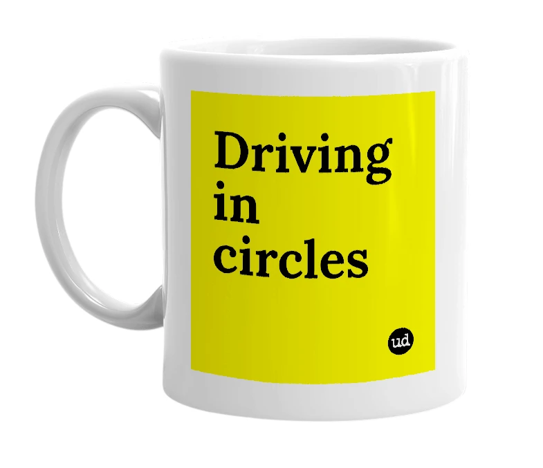 White mug with 'Driving in circles' in bold black letters