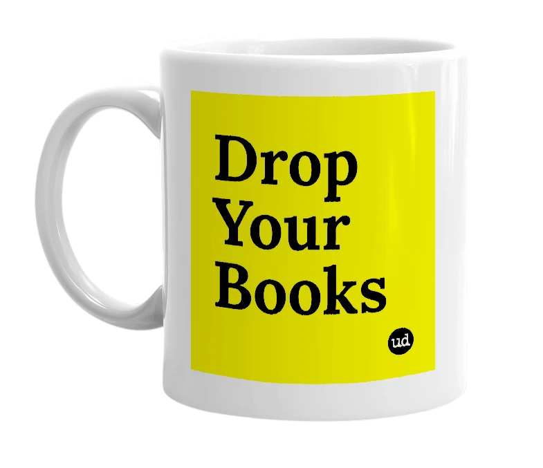 White mug with 'Drop Your Books' in bold black letters