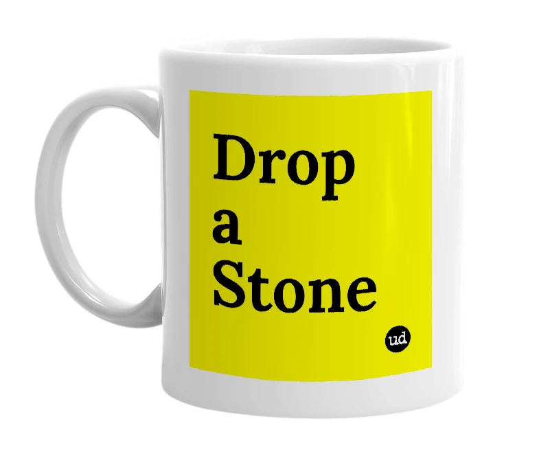 White mug with 'Drop a Stone' in bold black letters