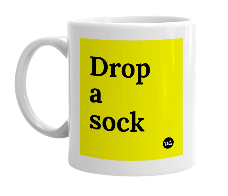 White mug with 'Drop a sock' in bold black letters
