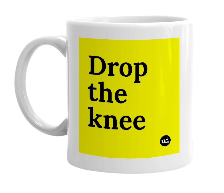White mug with 'Drop the knee' in bold black letters