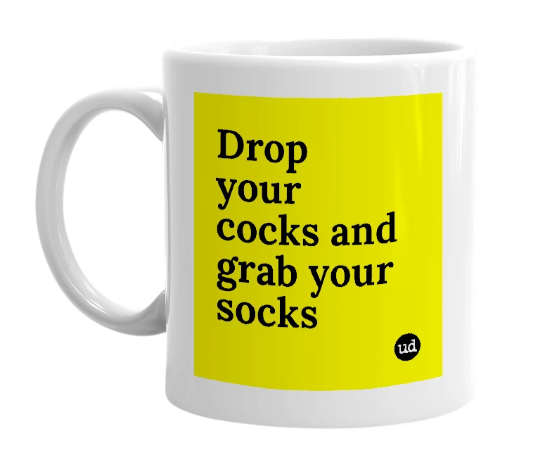 White mug with 'Drop your cocks and grab your socks' in bold black letters
