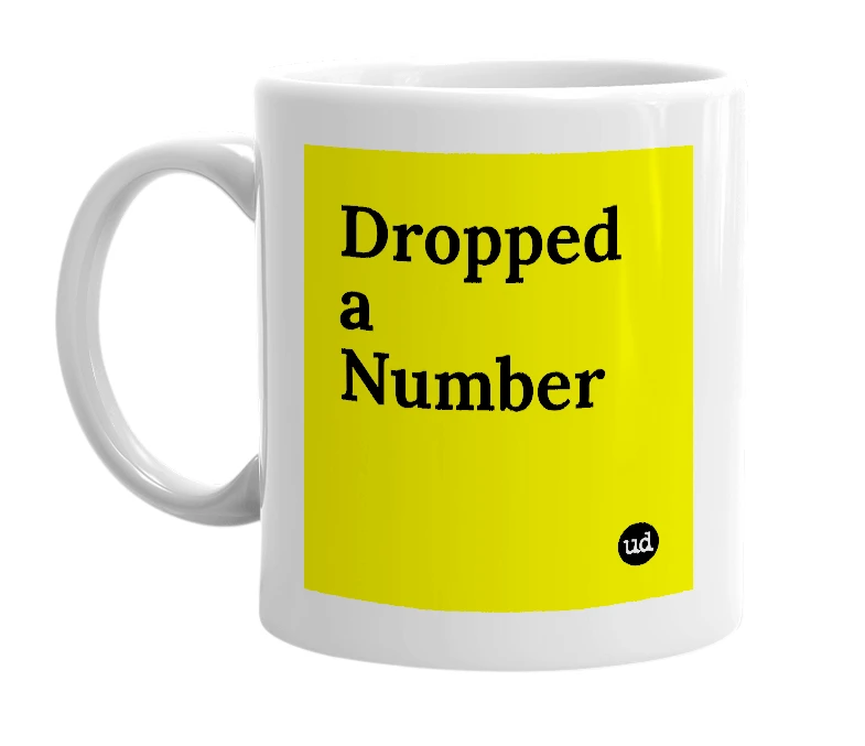 White mug with 'Dropped a Number' in bold black letters