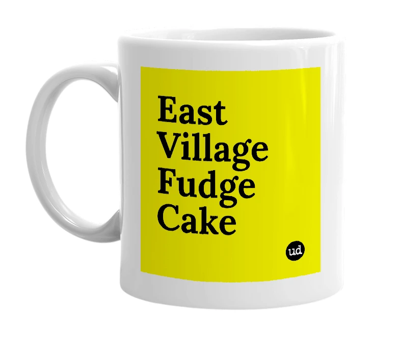 White mug with 'East Village Fudge Cake' in bold black letters